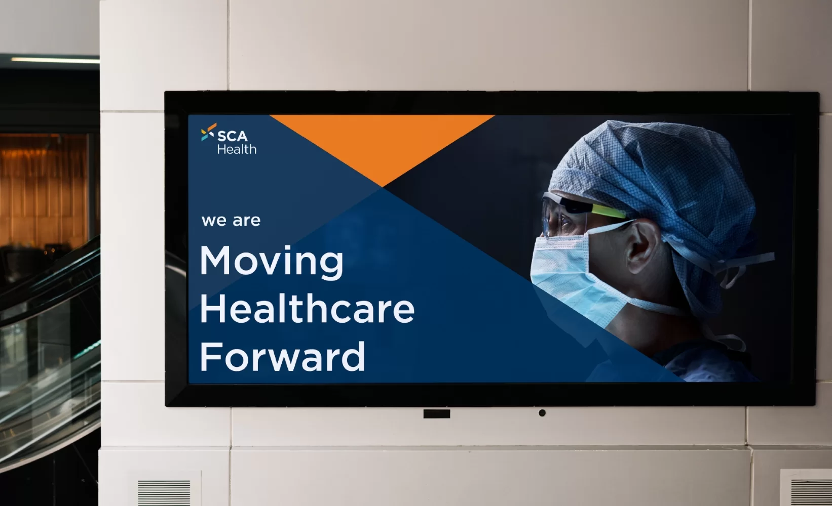 Photo of a SCA Health billboard advertisement with verbiage and a doctor hero-shot in the real world.