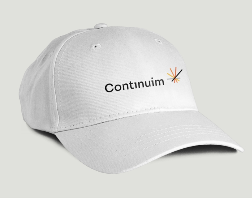 Closeup of the Continuim Logo on a baseball cap.