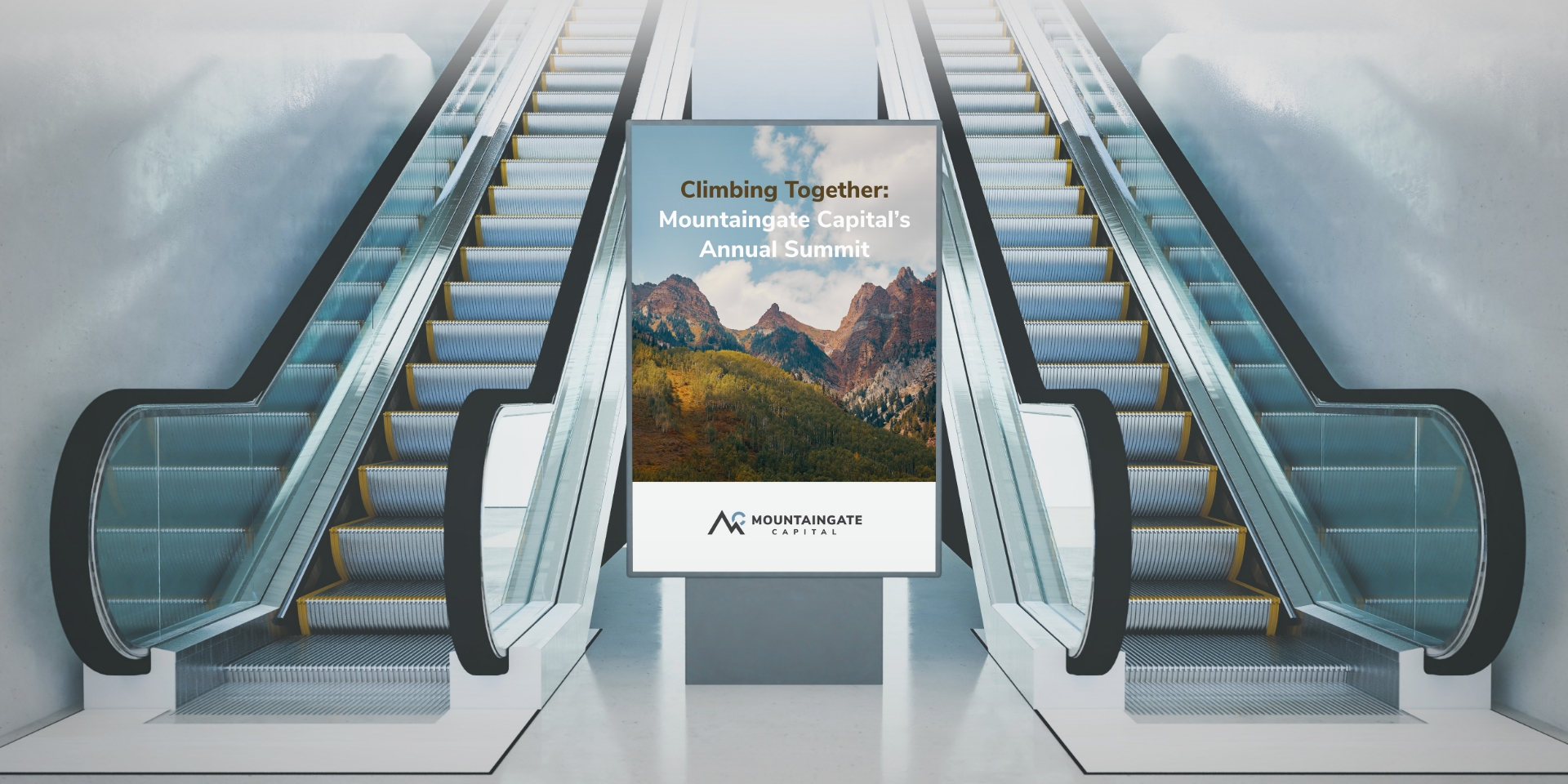 A pair of escalators, one going up and one going down, flank a large central poster displaying a mountain scene and the text Climbing Together: Mountaingate Capitals Annual Summit. The poster includes the Mountaingate Capital logo.