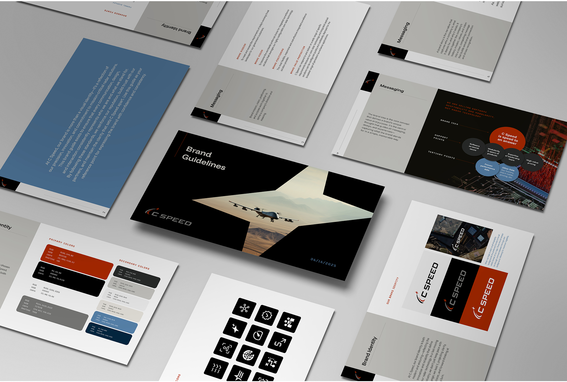 Flat lay of printed brand guideline documents for C SPEED, featuring pages with text, color palettes, icons, diagrams, and a cover page with an image of a jet flying over a desert landscape.