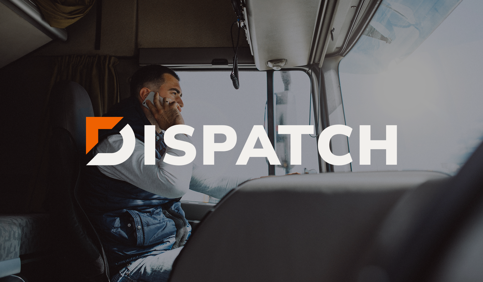 A person sits in the drivers seat of a truck, talking on a phone. The word DISPATCH is overlaid in bold white letters across the image.