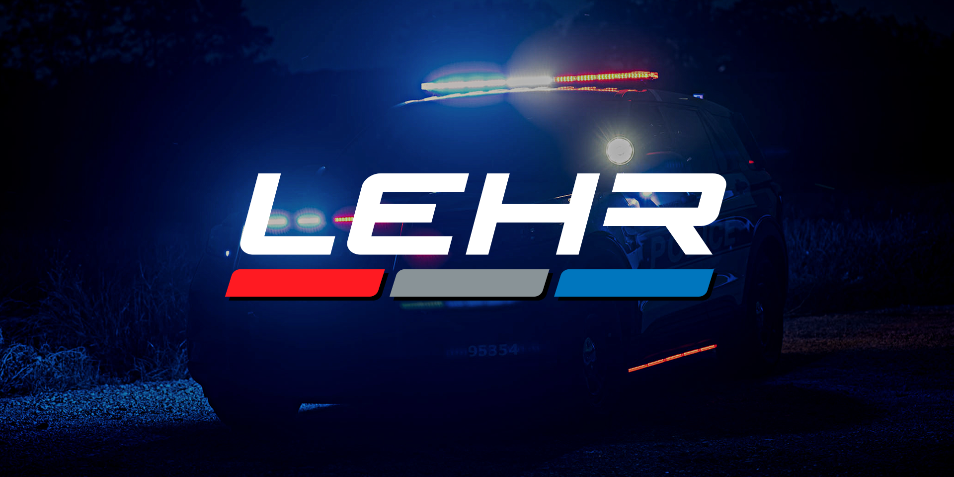 A police vehicle with flashing lights is parked at night. The bold text LEHR appears in front, with the letters underlined in red, gray, and blue stripes.